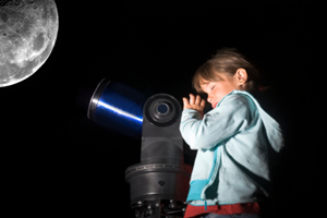 Girl looking at the moon