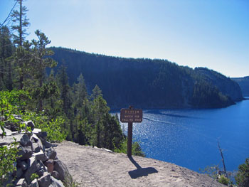 View of Crater Lake from Cleetwood Trail and a "Danger Watch for Falling Rock" trail sign