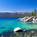 Beautiful blue Lake Tahoe with mountains framing the horizon