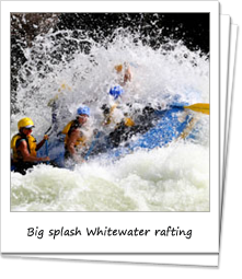Big splash of water covers whitewater rafters