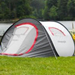 Self erecting tent pitched in front of a lake