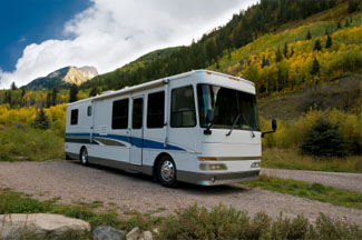 Class A motorhome parked in a mountain setting
