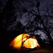 Lit tent camping outdoors