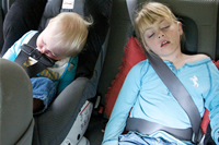 Children sleeping in car