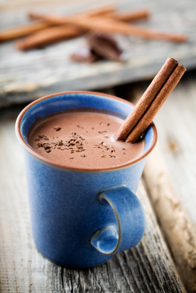 Hot chocolate with a cinnamon dipped in it