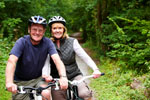 Mature couple on their bikes in the country