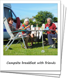 Seniors having breakfast together at a campsite