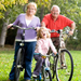 Grandparents biking with their granddaughter