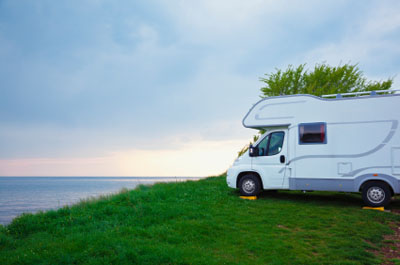RV at campsite on leveling blocks
