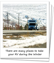 RV on the road with snow all round