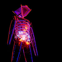 Burning Man all lit up at night