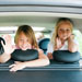 3 little girls in back seat of car