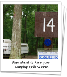 Occupied sign at campsite with trailer