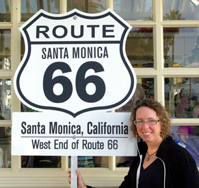 Sandi next to west end of Route 66 Santa Monica California sign
