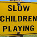 Campground sign that reads slow children playing