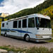 Class A motorhome parked in a mountain setting