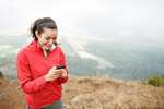 Female hiker using a smartphone