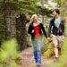 Couple walking along a forest trail
