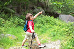 Little child hiking and pointing