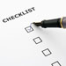 Pen tick a box on a checklist