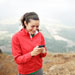 Female hiker using a smartphone