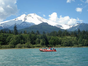 Baker Lake with a raft and Mount Baker covered in snow in the background