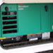 Green RV generator housed in RV compartment