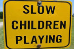 Campground sign that reads "Slow Children Playing"