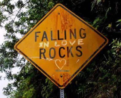 Falling Rocks road sign that has been changed to "Falling in Love Rocks "