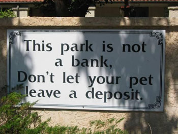 Campground sign that reads "This park is not a bank. Don't let your pet leave a deposit."