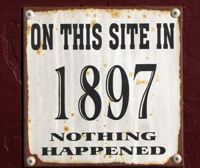 Campground sign that reads "On This Site in 1897 nothing happened"