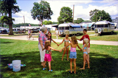 Children hold hands in a circle