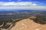 View from Devil's Playground on Pikes Peak looking at the winding Pikes Peak Highway with scenic view of Colorado behind