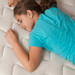 Young girl resting on a mattress