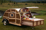 Bulleit Frontier Whiskey Woody-Tailgate Trailer open showing drinks at a bar