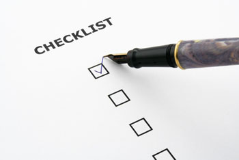 Pen tick a box on a checklist