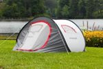 Self erecting tent pitched in front of a lake